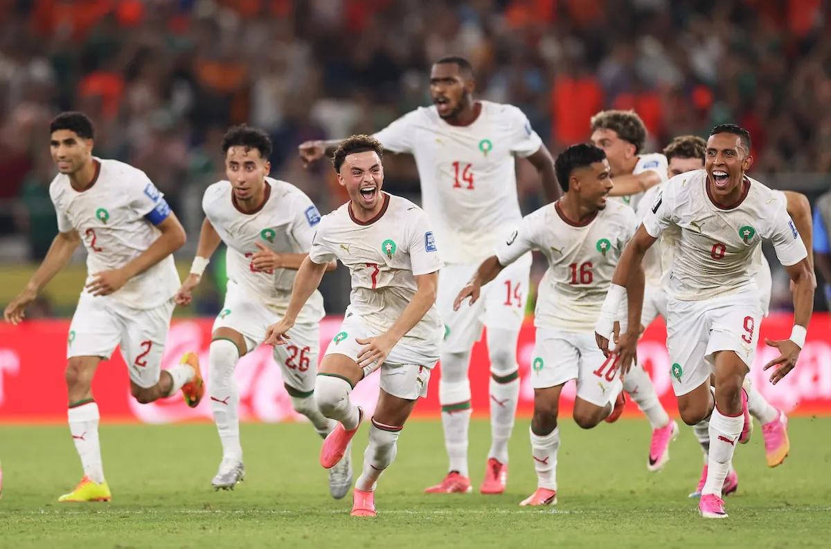Morocco players rush to congratulate Saibari at the end of Monday's shootout.Carl Recine/Getty Images