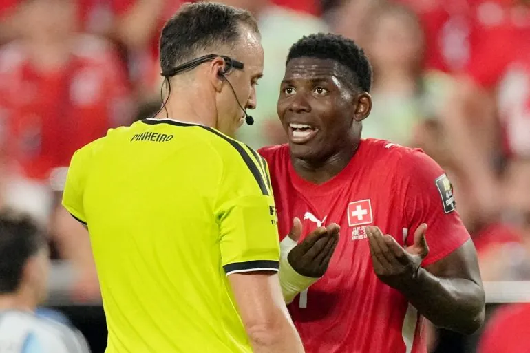Soccer Football - FIFA World Cup 2026 - Quarter Final - Argentina v Switzerland - Kansas City Stadium, Kansas City, Missouri, U.S. - July 11, 2026 Switzerland's Breel Embolo remonstrates with referee Joao Pedro Silva Pinheiro IMAGN IMAGES via Reuters/Denny Medley