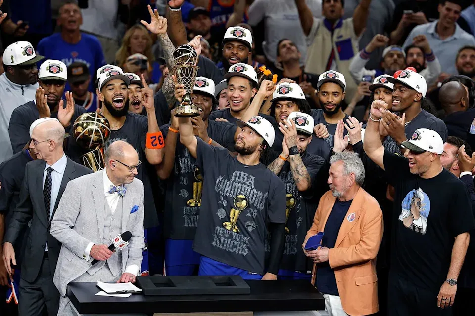 Jalen Brunson lifts the Bill Russell NBA Finals Most Valuable Player Award trophy after defeating the San Antonio Spurs in Game Five of the 2026 NBA Finals at Frost Bank Center on June 13, 2026 in San Antonio, TexasCredit: Ronald Cortes/Getty