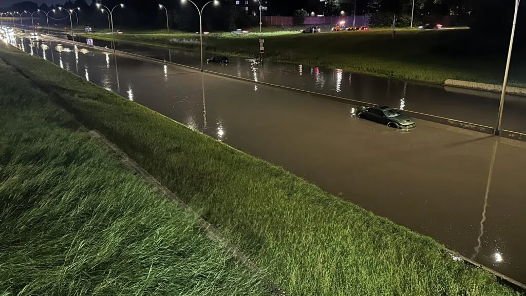 Car seen near a flooded overpass by Whitemud and 159 Street after heavy rains on July 25, 2026 (CityNews)