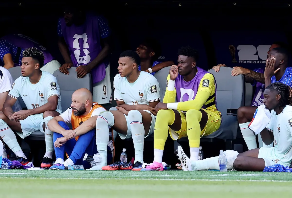 Mbappe is seen on the bench with an ice pack on his right ankle during the match.Kevin C. Cox/Getty Images